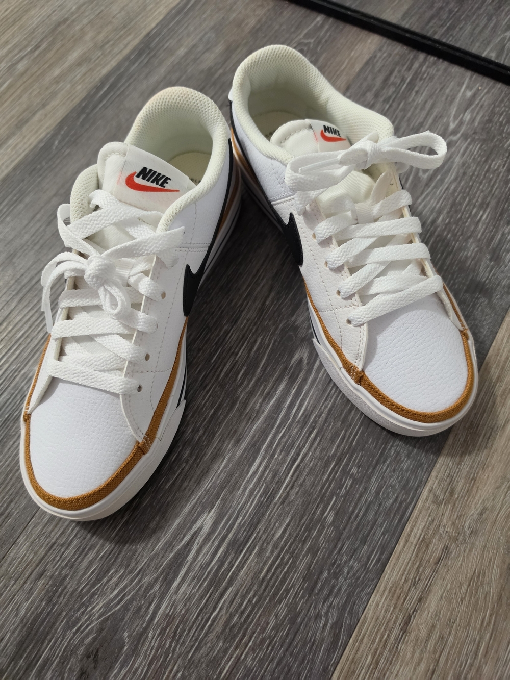 Nike Women’s White Sneakers with Black Swoosh and Brown Trim